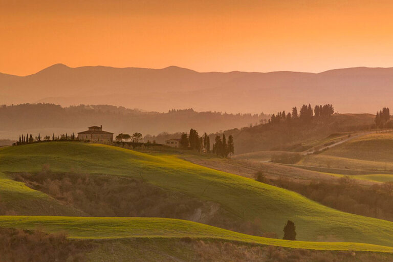 Panoramic sunset view over the iconic Chianti rolling hills and vineyards in Tuscany during an exclusive Baroque Bacchus tour